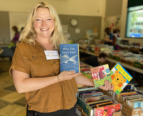 Selling $1 books to make the library and community even better